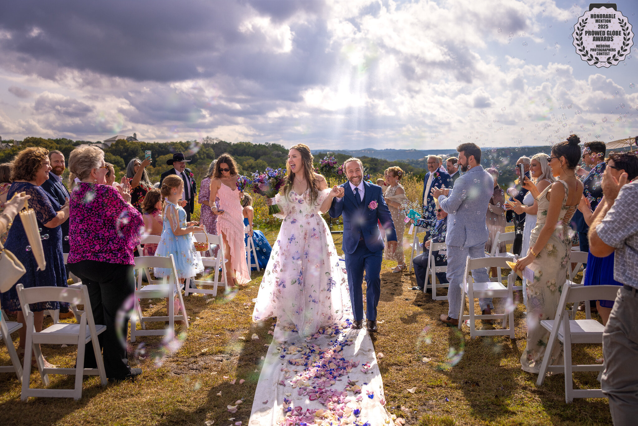 Hill Country wedding recessional with bubbles by GR Weddings